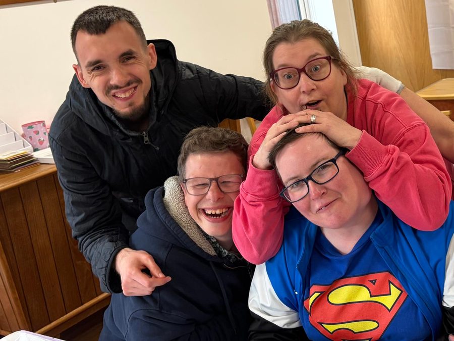 Members and staff sharing a fun moment together