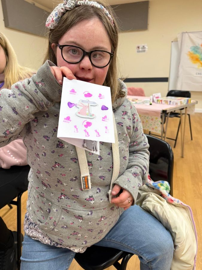 A member showing an Easter card made in a creative session